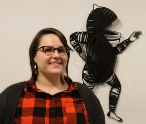 Kate and one of her creations in the Eva G. Farris Art Gallery during her show "Notes on Habitivity Appendix."