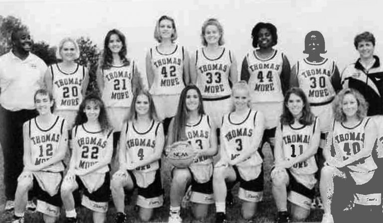 1996 yearbook photo of women's basketball team. Shannon Galbraith-Kent is second from right kneeling.