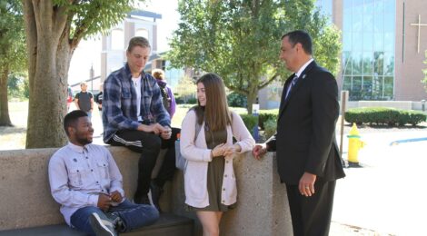 President Chillo talks with students on Thomas More University campus