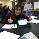 A high school teacher (Ms. Melissa Stolz) is excited to share the results of her pollinator syndrome activity, facilitated by Dr. Dustin Swanson, seen standing (Thomas More College, Biological Sciences).