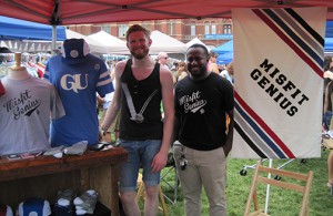Jason Matheny and Monty Collier display their fall 2014 clothing line at a festival in downtown Cincinnati.
