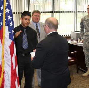 Jesus being sworn in by Dr. Eddie Oestreicher in President David A. Armstrong's office on the TMC campus