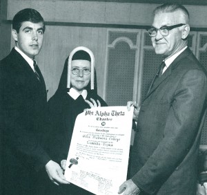 1966 photo of original charter presentation by Dr. Lynn Turner (right) to History Chairperson Sr. Mary Albert, SND, and William T. (Bill) Robinson III ’67, chapter president.