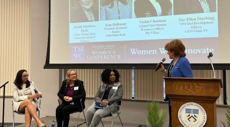 Picture of a panel of women on stage