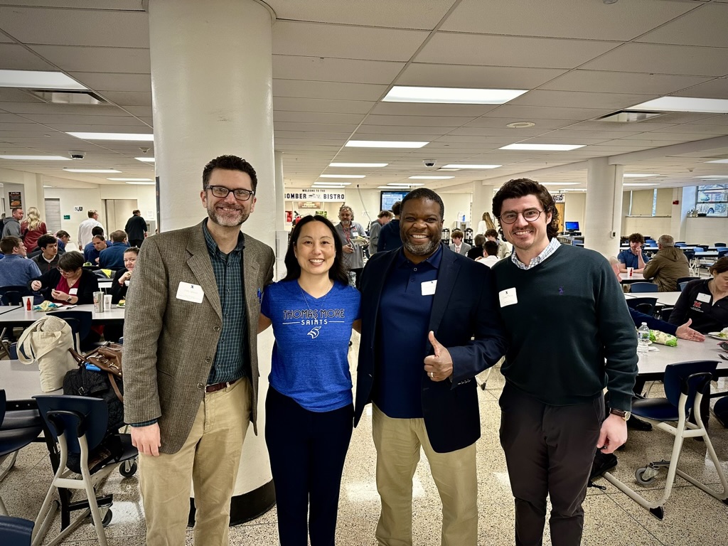 Thomas More faculty members Phillip Webster, Jeni Al Bahrani, Yvan Demosthenes, and Greg Mazza performing as judges at the X-Squared High School Pitch Competition.