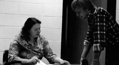 Thomas More Professor Ann Hicks speaks with a student in her early years.