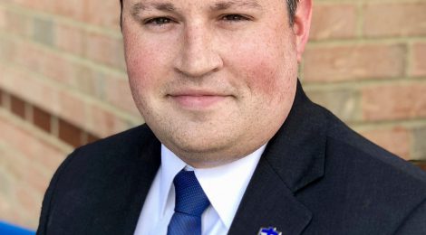 Man in suit with blue tie