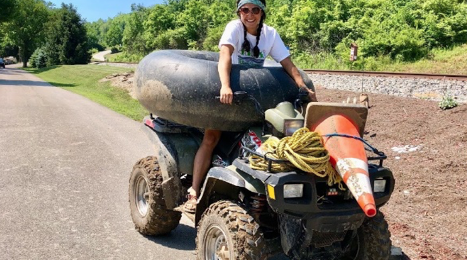 Erin Carrus with some trash found during River Sweep